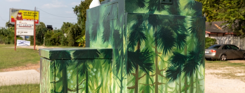 Trees painted on a traffic control box